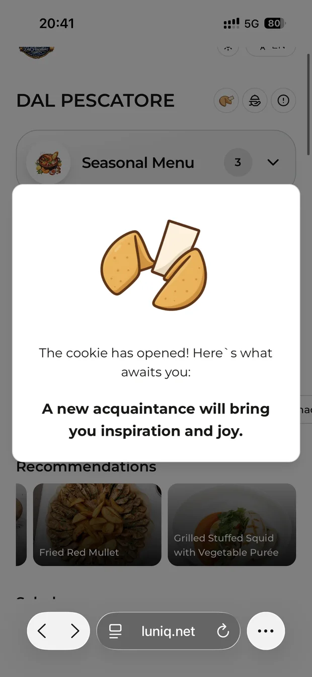 A fortune cookie opened in the Dal Pescatore menu